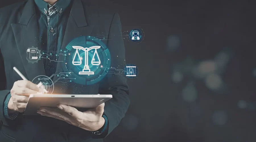 A person in a suit using a stylus on a tablet that displays glowing holographic legal icons, including the scales of justice and a gavel.