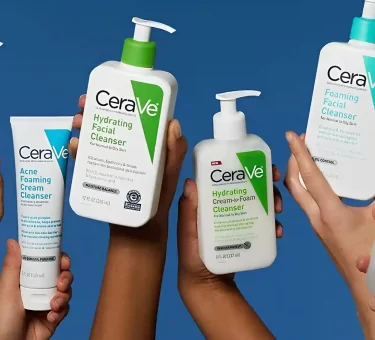 Five diverse hands hold up various white and clear plastic bottles of CeraVe skincare cleansers, including Acne Control, Hydrating Facial, Hydrating Cream-to-Foam, Foaming Facial, and Renewing SA cleansers, against a solid blue backdrop and the image is being use for CeraVe Class Action Lawsuit.