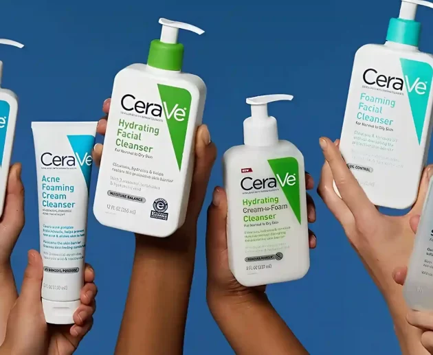 Five diverse hands hold up various white and clear plastic bottles of CeraVe skincare cleansers, including Acne Control, Hydrating Facial, Hydrating Cream-to-Foam, Foaming Facial, and Renewing SA cleansers, against a solid blue backdrop and the image is being use for CeraVe Class Action Lawsuit.