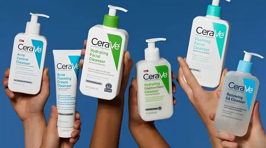 Five diverse hands hold up various white and clear plastic bottles of CeraVe skincare cleansers, including Acne Control, Hydrating Facial, Hydrating Cream-to-Foam, Foaming Facial, and Renewing SA cleansers, against a solid blue backdrop and the image is being use for CeraVe Class Action Lawsuit.